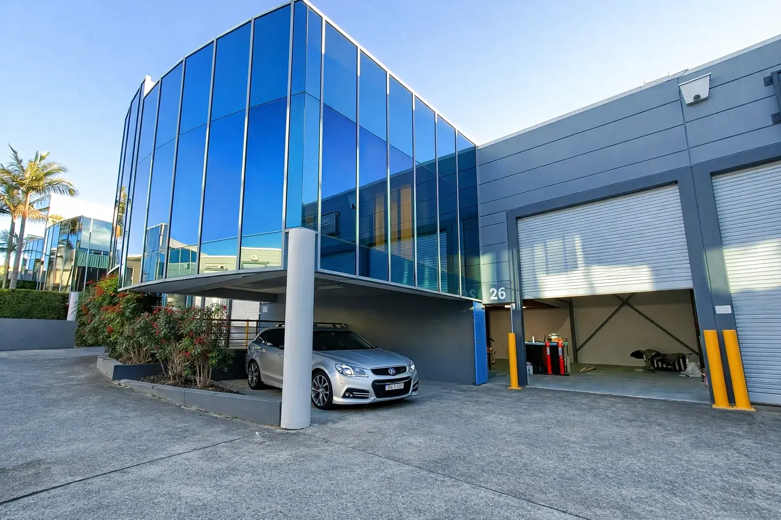 Commercial building exterior with tinted glass curtain wall
